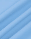 Close-up of the smooth stretch performance fabric used on the MotionFlow Flared Leg Jumpsuit in Blue