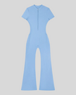 MotionFlow Flared Leg Jumpsuit in Blue front view featuring a mock neck, quarter-zip front, and flared legs