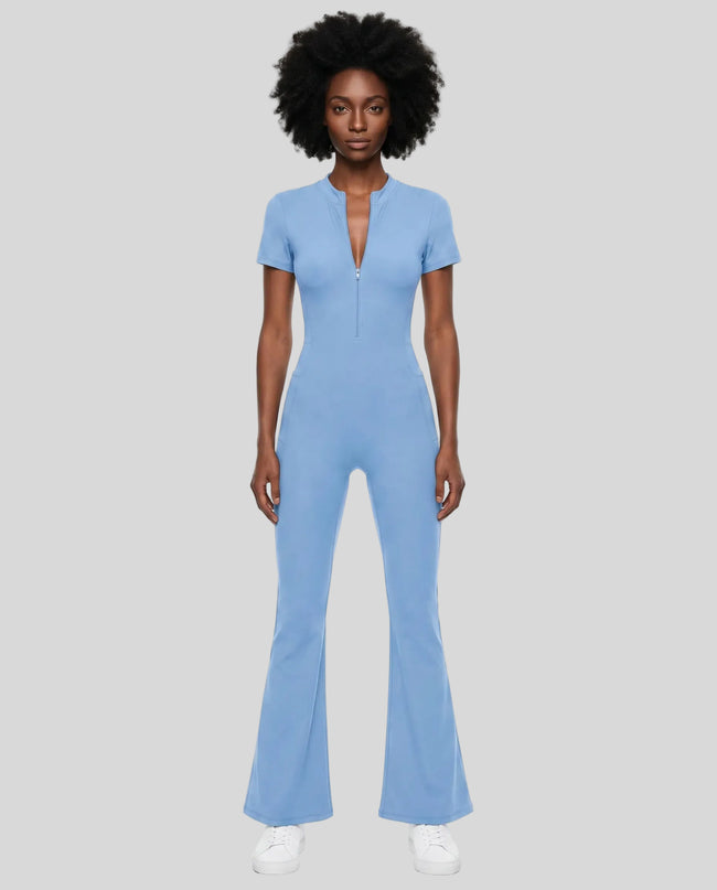 Model wearing the MotionFlow Flared Leg Jumpsuit in Blue viewed from the front