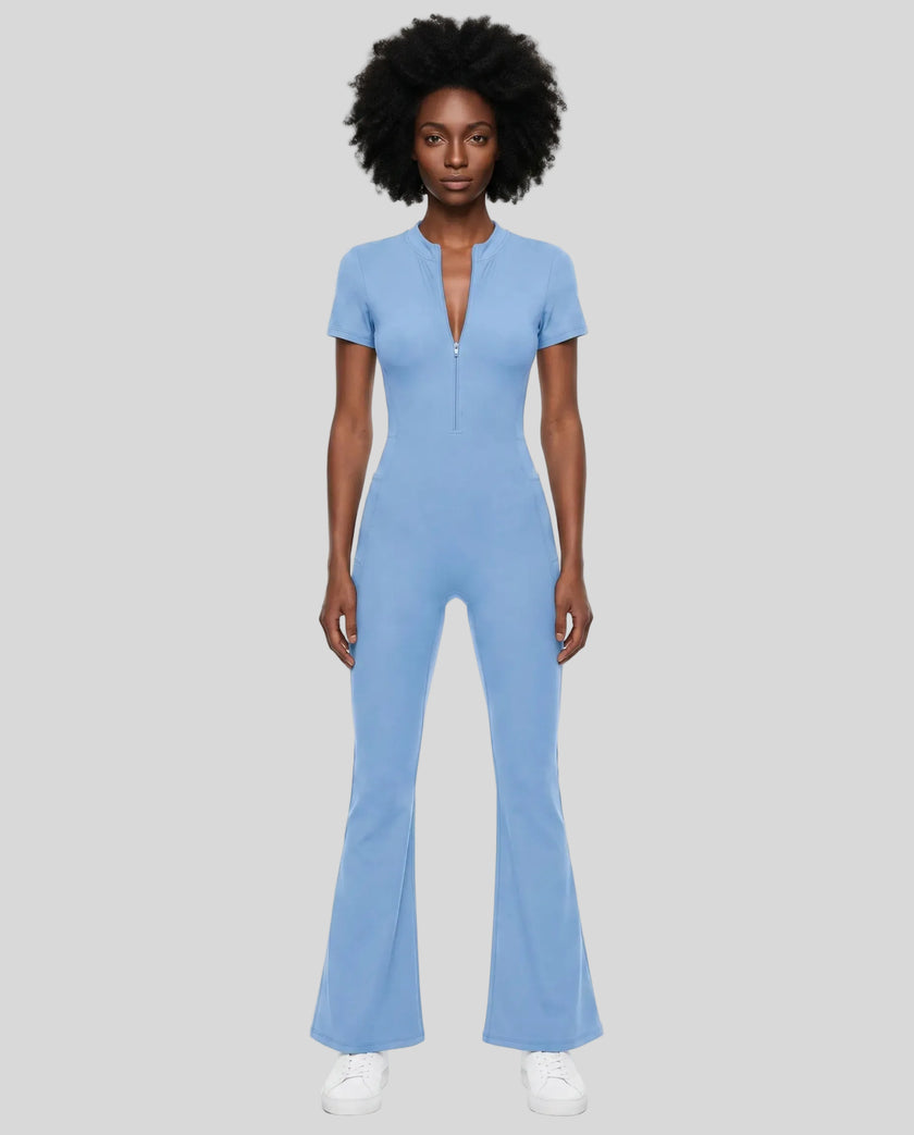 Model wearing the MotionFlow Flared Leg Jumpsuit in Blue viewed from the front
