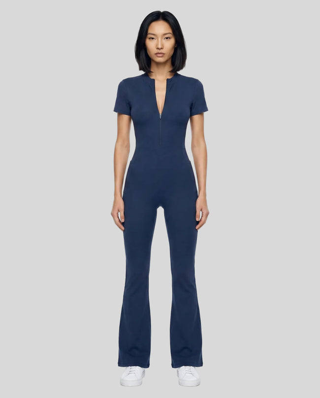 Model wearing the MotionFlow Flared Leg Jumpsuit in Royal Blue viewed from the front