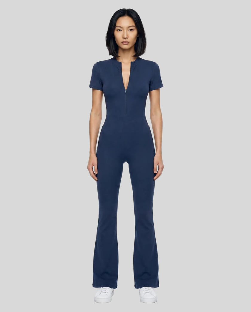 Model wearing the MotionFlow Flared Leg Jumpsuit in Royal Blue viewed from the front