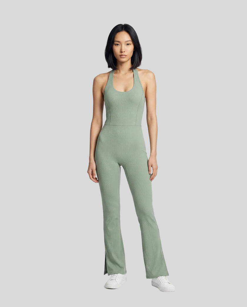 Model wearing the MotionFlow Halter Jumpsuit in Gray Green viewed from the front
