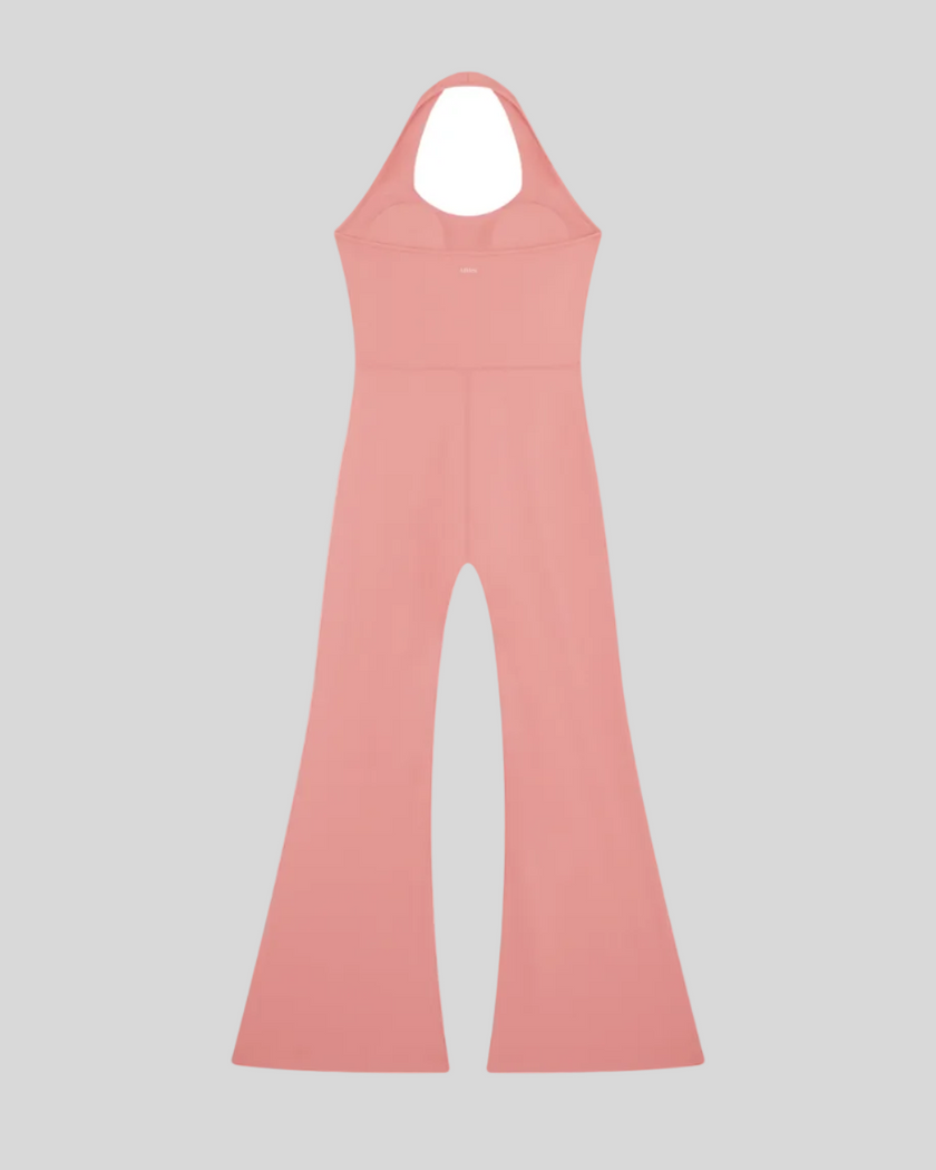 MotionFlow Halter Jumpsuit in Pink back view showcasing the open-back halter design and flared legs