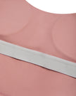 Close-up of the chest padding construction on the MotionFlow Halter Jumpsuit in Pink