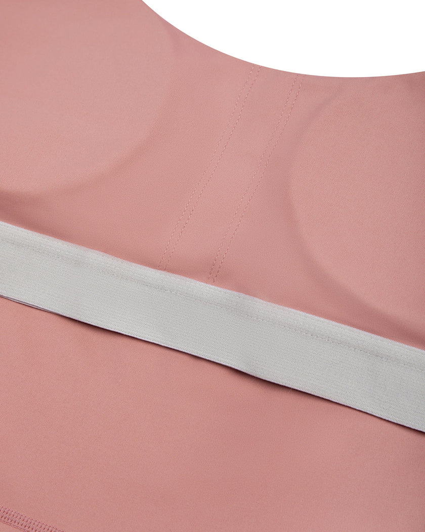 Close-up of the chest padding construction on the MotionFlow Halter Jumpsuit in Pink