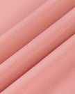 Close-up of the lightweight stretch performance fabric used on the MotionFlow Halter Jumpsuit in Pink