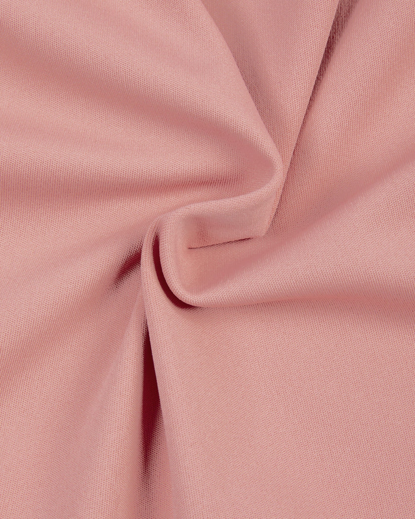 Detailed view of the smooth polyester-spandex fabric and stitching on the MotionFlow Halter Jumpsuit in Pink