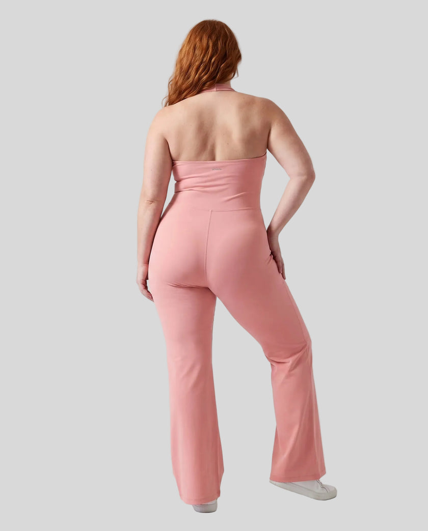 Back view of a model wearing size large MotionFlow Halter Jumpsuit in Pink