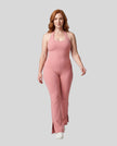 Model wearing size large MotionFlow Halter Jumpsuit in Pink viewed from the front
