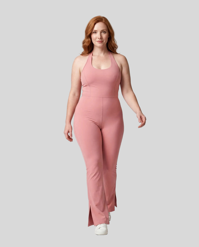 Model wearing size large MotionFlow Halter Jumpsuit in Pink viewed from the front