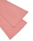 Close-up of the flared leg hem on the MotionFlow Halter Jumpsuit in Pink