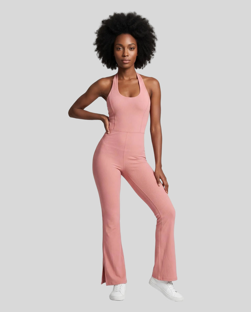 Model wearing the MotionFlow Halter Jumpsuit in Pink viewed from the front
