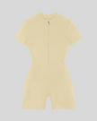 MotionFlow Romper in Apricot front view featuring a mock neck, quarter-zip front, and bermuda-length shorts