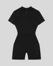 MotionFlow Romper in Black back view showcasing the sculpted silhouette and bermuda-length shorts