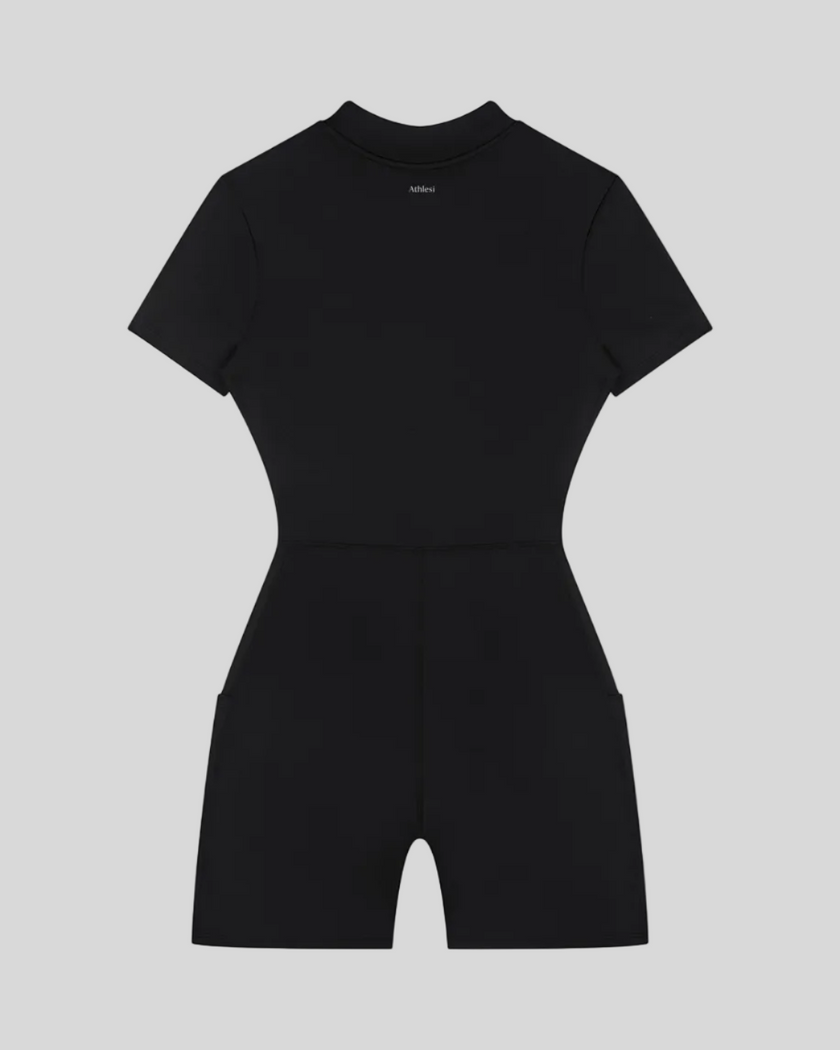 MotionFlow Romper in Black back view showcasing the sculpted silhouette and bermuda-length shorts