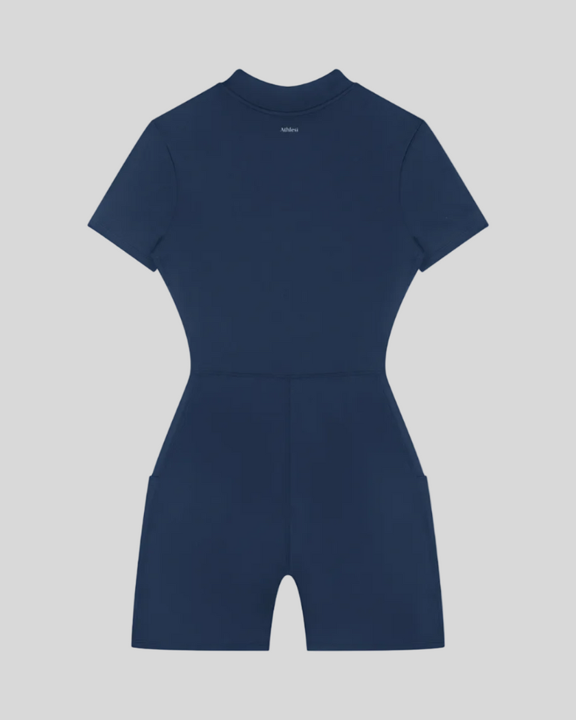 MotionFlow Romper in Navy Blue back view showcasing the sculpted silhouette and bermuda-length shorts