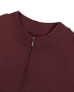 Close-up of the mock neckline and quarter-zip closure on the MotionFlow Romper in Wine Red