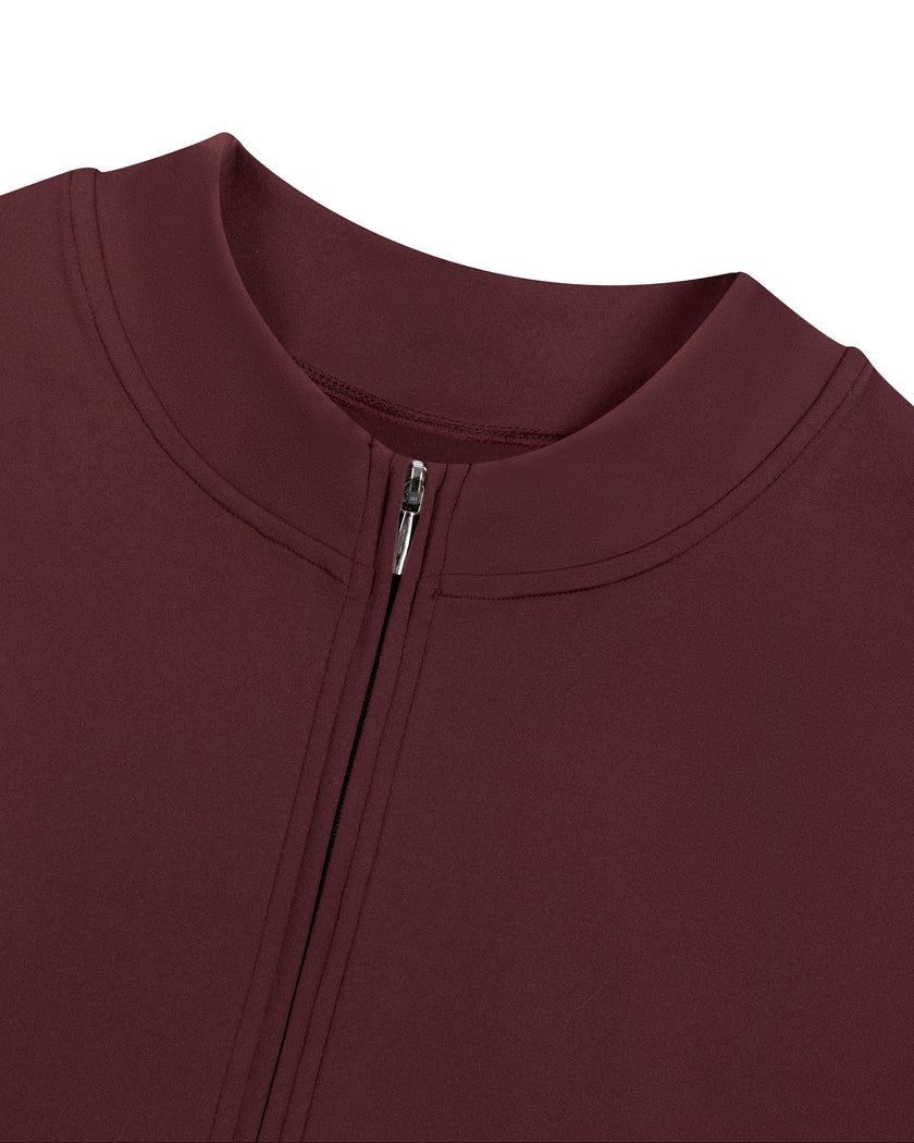 Close-up of the mock neckline and quarter-zip closure on the MotionFlow Romper in Wine Red