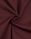 Detailed view of the premium nylon-spandex fabric and stitching on the MotionFlow Romper in Wine Red