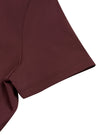 Close-up of the short sleeve construction on the MotionFlow Romper in Wine Red