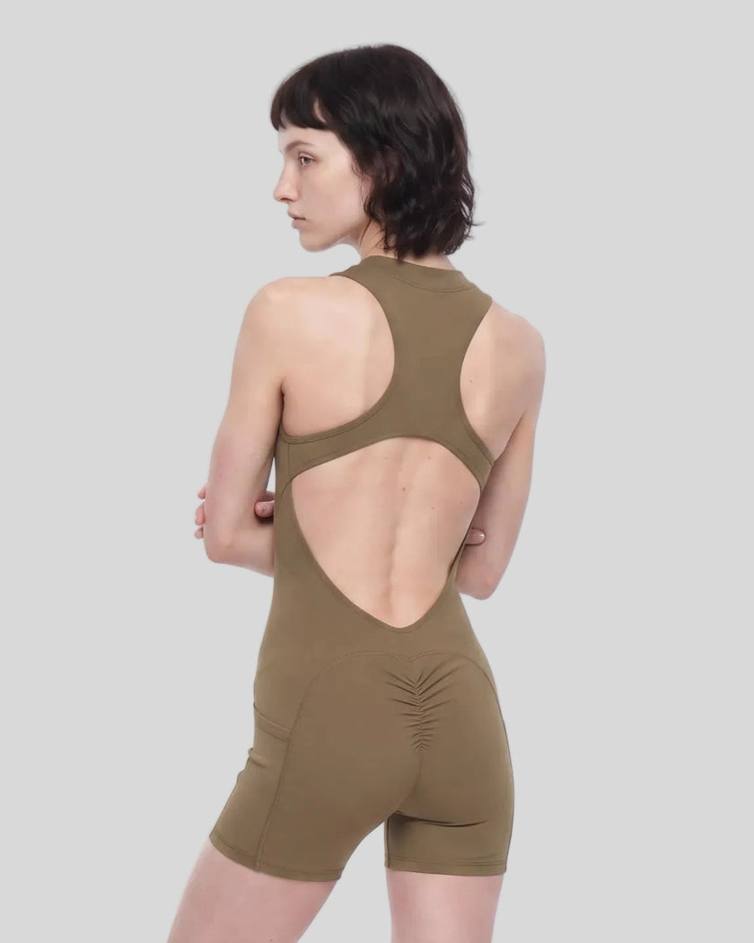 Back view of a model wearing the MotionFlow Yoga Romper in Coffee