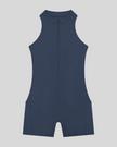 MotionFlow Yoga Romper in Navy Blue front view featuring a mock neck, quarter-zip front, and above-the-knee silhouette