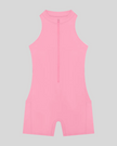 MotionFlow Yoga Romper in Pink front view featuring a mock neck, quarter-zip front, and above-the-knee silhouette