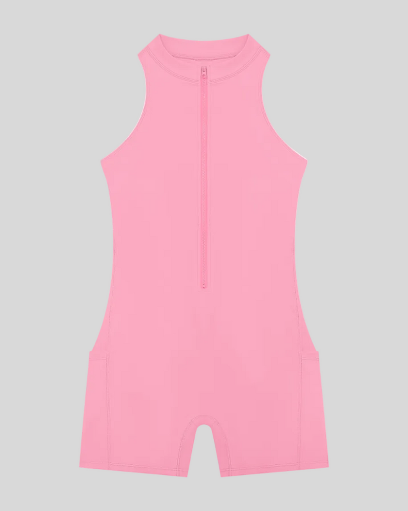 MotionFlow Yoga Romper in Pink front view featuring a mock neck, quarter-zip front, and above-the-knee silhouette