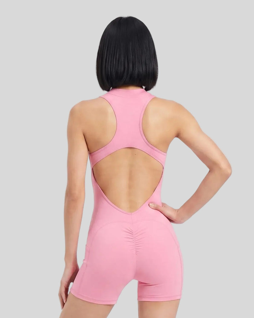Back view of a model wearing the MotionFlow Yoga Romper in Pink