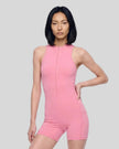 Model wearing the MotionFlow Yoga Romper in Pink viewed from the front