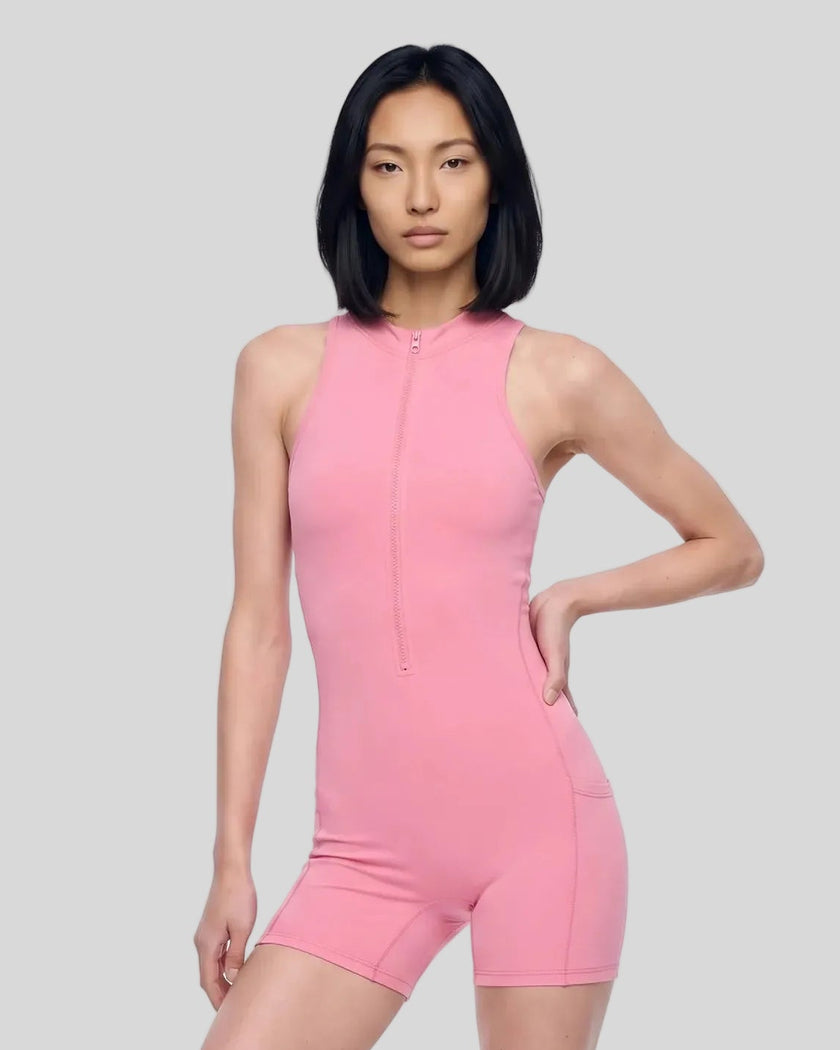Model wearing the MotionFlow Yoga Romper in Pink viewed from the front