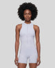 Model wearing the MotionFlow Yoga Romper in Purple viewed from the front