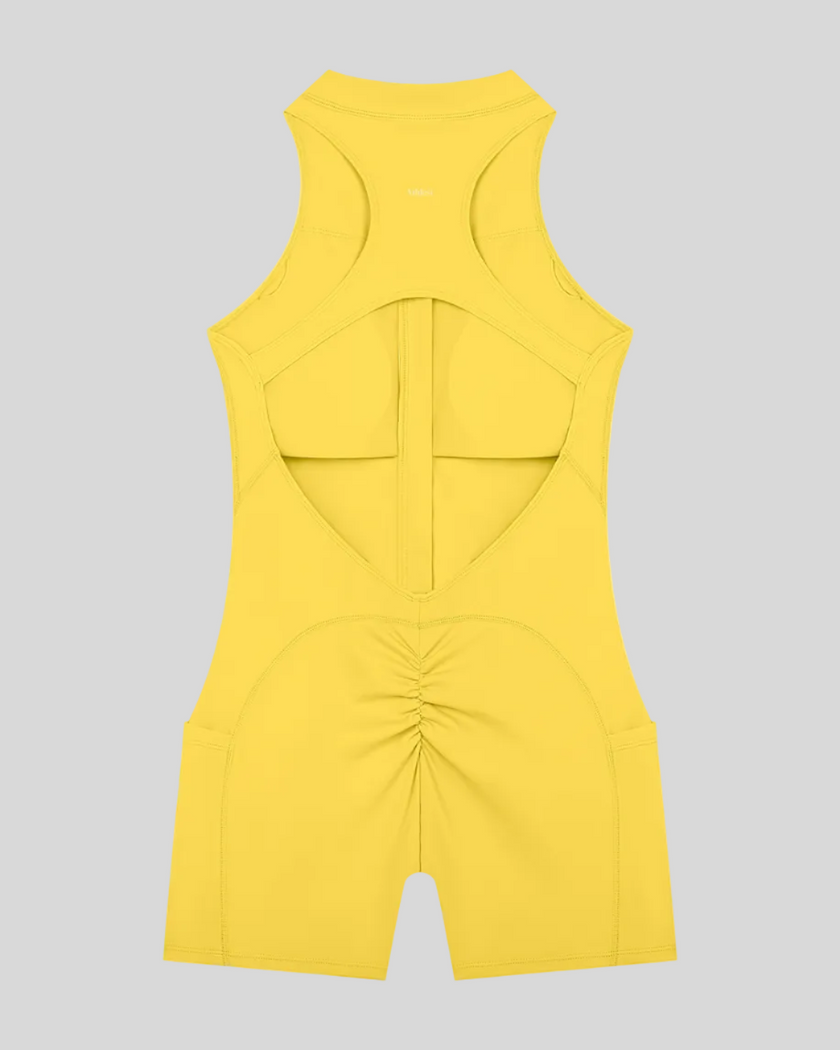 MotionFlow Yoga Romper in Yellow back view showcasing the open racerback design and sculpting fit