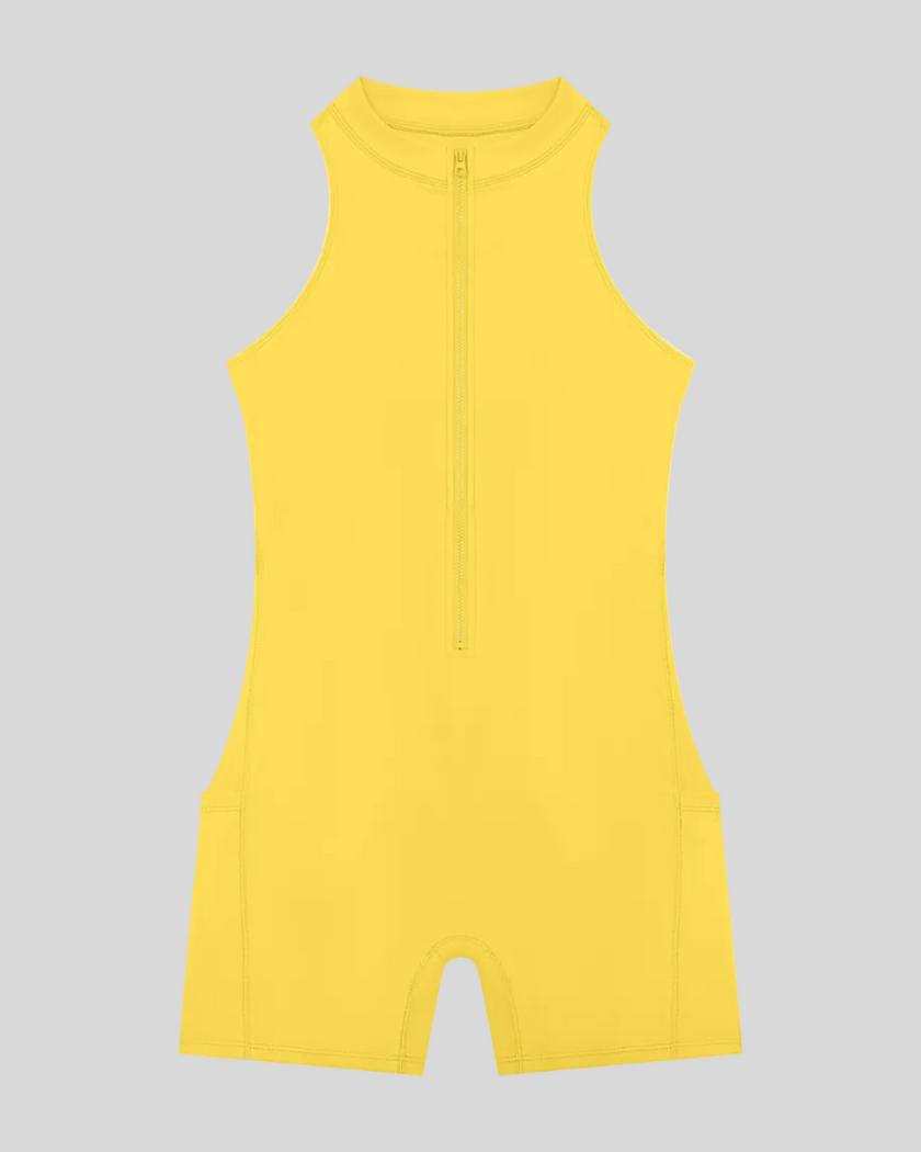 MotionFlow Yoga Romper in Yellow front view featuring a mock neck, quarter-zip front, and above-the-knee silhouette