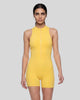 Model wearing the MotionFlow Yoga Romper in Yellow viewed from the front