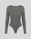 Athlesi MotionForm Long Sleeve Bodysuit in Gray, front view showing the U-neckline and fitted long sleeve silhouette