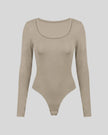 Athlesi MotionForm Long Sleeve Bodysuit in Khaki, front view showing the U-neckline and fitted long sleeve silhouette