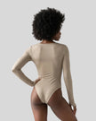Model wearing the Athlesi MotionForm Long Sleeve Bodysuit in Khaki, back view highlighting the smooth fitted silhouette