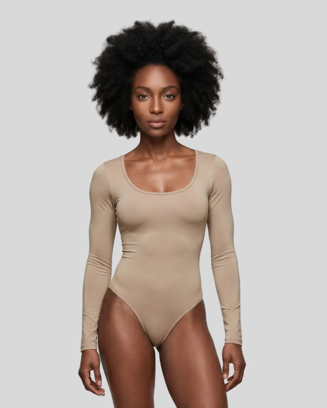 Model wearing the Athlesi MotionForm Long Sleeve Bodysuit in Khaki, front view highlighting the U-neckline and fitted silhouette
