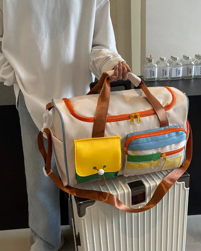 MotionPlay Travel Bag placed on luggage showing travel-ready design and organized compartments