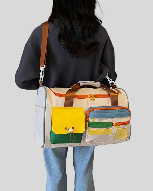 Model carrying MotionPlay Travel Bag on shoulder highlighting size and functionality