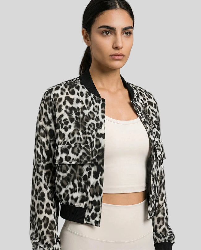 MotionSnap Bomber Jacket Signature in dark gray leopard worn by model mid body front view highlighting fit and details