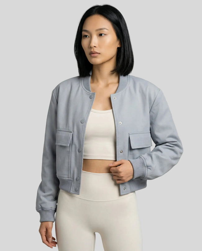 MotionSnap Bomber Jacket Signature in light blue worn by model mid body front view highlighting fit and details