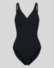 MotionZip Ruched Bodysuit in Black front view with ruched bust, adjustable straps and front zipper