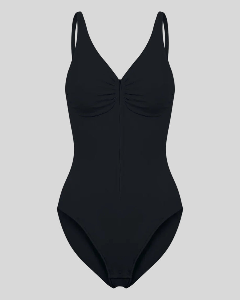 MotionZip Ruched Bodysuit in Black front view with ruched bust, adjustable straps and front zipper