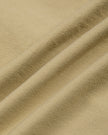 Close-up of Khaki stretch nylon-blend fabric on the MotionZip Ruched Bodysuit