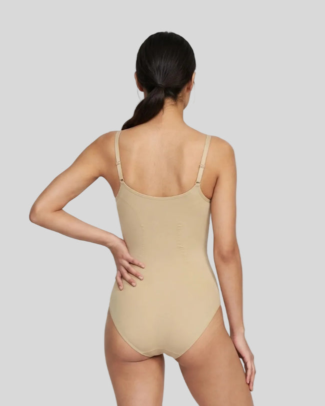 Woman wearing the MotionZip Ruched Bodysuit in Khaki from the back showing its streamlined fit and adjustable straps