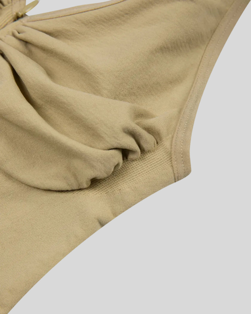 Side close-up of MotionZip Ruched Bodysuit in Khaki showing bust shaping, arm opening and fitted construction