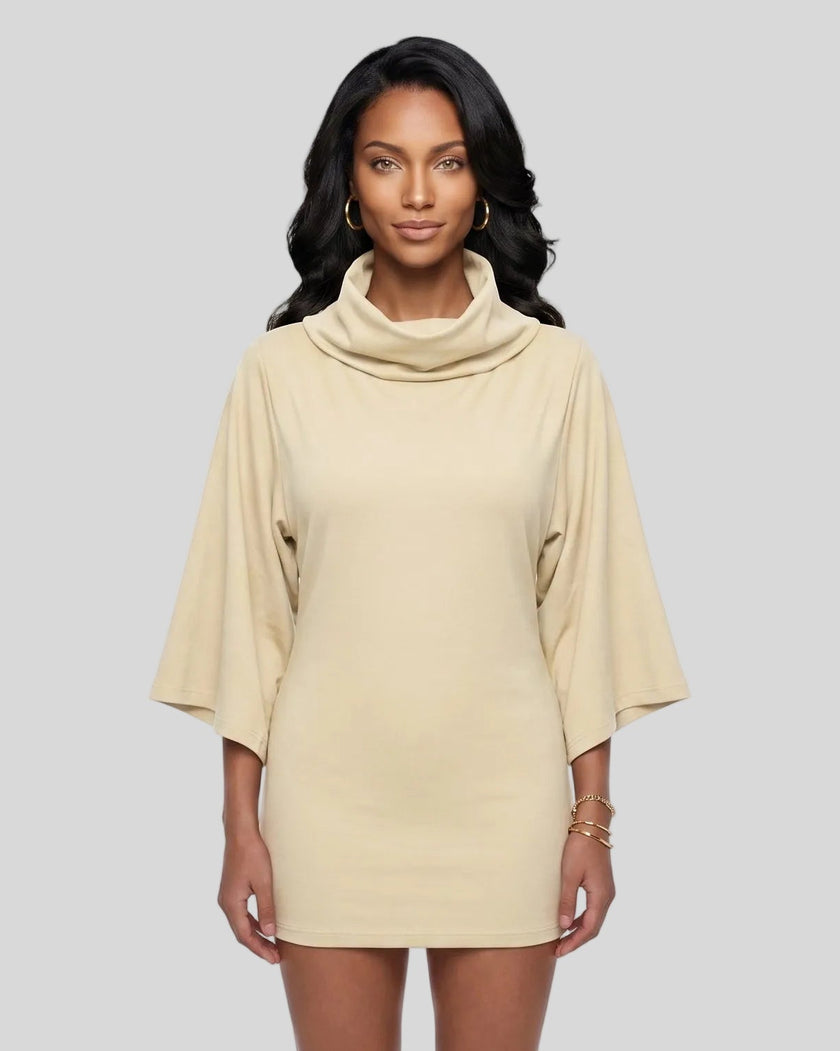 Mid body front view of a woman modeling apricot Muse Cowl Neck Tunic with wide three-quarter sleeves